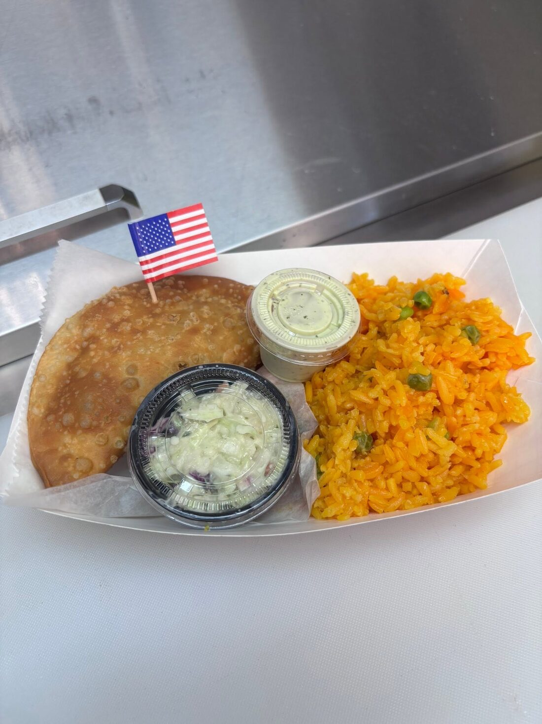 Franks N' Beans empanada with crinkle fries